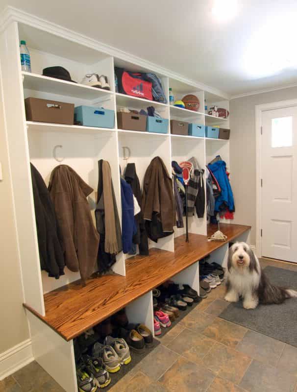 The mud room of this Princeton, NJ home keeps coats, shoes, and sports equipment neat.